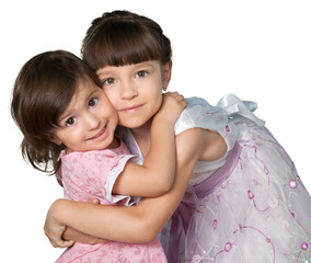 Portrait of beautiful girls hugging and posing while looking at camera, isolated on white