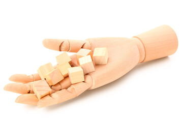 Wooden hand with cubes isolated on white background