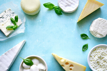 Food background with different types of cheese. Top view with copy space.