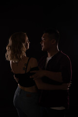 man and woman dance bachata kizomba latina in the dark