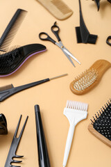 Composition with hairdressing accessories on beige background