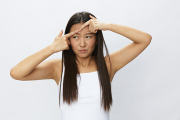 Asian woman facial skin problems, acne and inflammation, red rashes and allergies, chicken pox,...