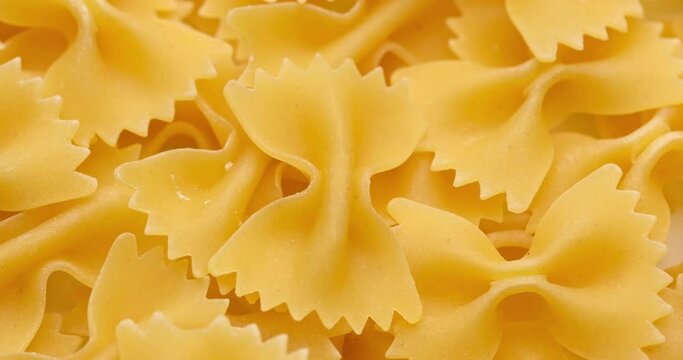 pasta backgroud - macro view of Dry Authentic Italian farfalle