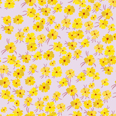 Vector seamless pattern with stylized floral motif, lots of small flowers on a light pink background. Hand-drawn little yellow flowers. Seamless floral background in yellow tones.