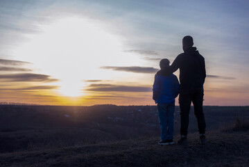 Dad and daughter. Father's Day Dad hugs the child. Family