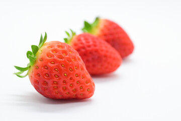 beautiful three fresh red strawberry isolated on white background