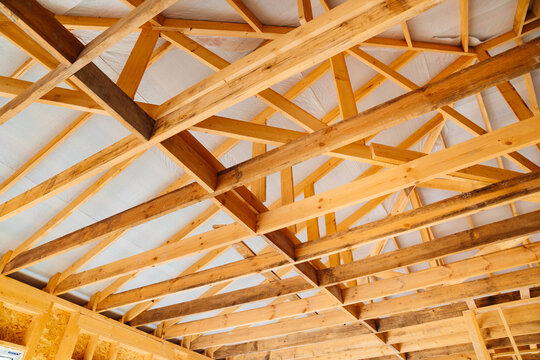 wooden beams inside the house under construction. roof construction.