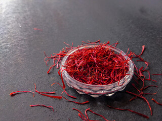 the saffron kept on a textured black background and lighting