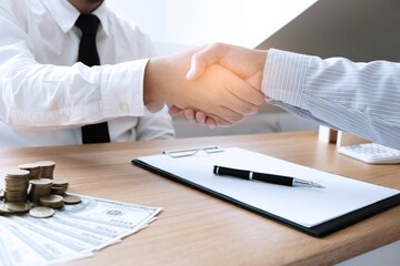 Business people signing contract making a deal with real estate agent Concept for consultant and home insurance concept.