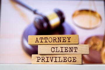 Wooden blocks with words 'Attorney-Client Privilege'. Legal concept