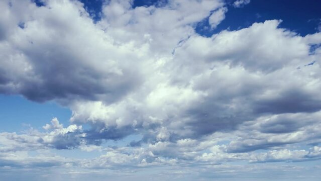 Blue sky background with clouds drifting loop. 4k resolution, 60fps