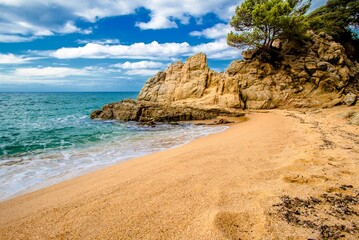 Sea surf on the beach of Santa Cristina in Lloret de Mar
