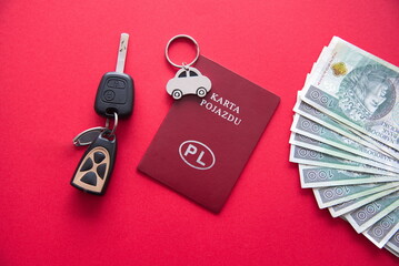 Zdjecie ilustracyjne - ubezpieczenie auta, OC, leasingi. Symboliczne auto, gotowka, karta pojazdu i kluczyki.