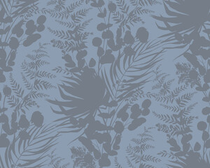 Seamless pattern with silhouettes of tropical palm leaves and branches. Monochrome pattern for unisex textiles with botanical theme and surface design