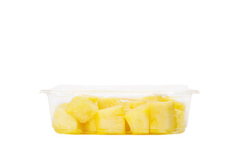 Fruit salad with pineapple in a plastic container on a white background.