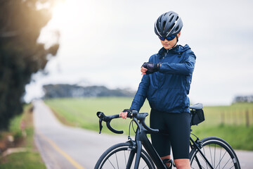 Cyclist woman, check time and nature on road for speed, gps and heart rate with fitness, health and...