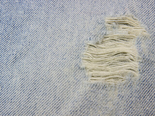 Fabric from the sewing stitches of jeans background texture.