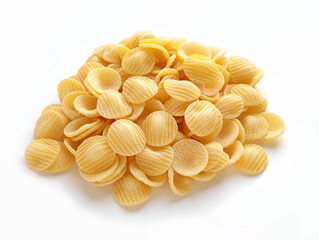 Raw striped shell pasta on white background with clipping path, italian national cuisine traditional uncooked ingredient. Raw dry pasta heap on white background. Conchiglie rigate