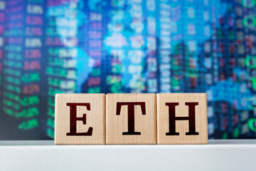 ETH - acronym from wooden cubes with letters, Ethereum. Financial market concept