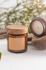 Soy aroma candle in a glass jar with a wooden lid. Copy space label. Beauty and spa. Aromatherapy at home. Scented candles set. Minimalism aesthetic background. Cozy romance mood.