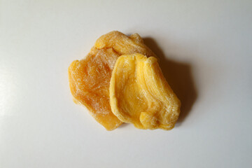 Two pieces of fleshy yellow dried jack fruit from above