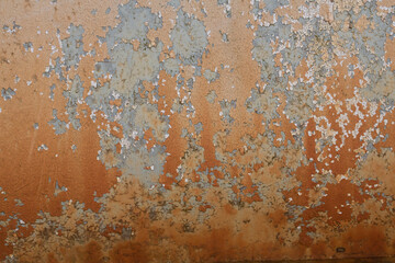 Rusted steel plate. Abandoned house, ruins. Metal. Background material. Stone, rock, etc…