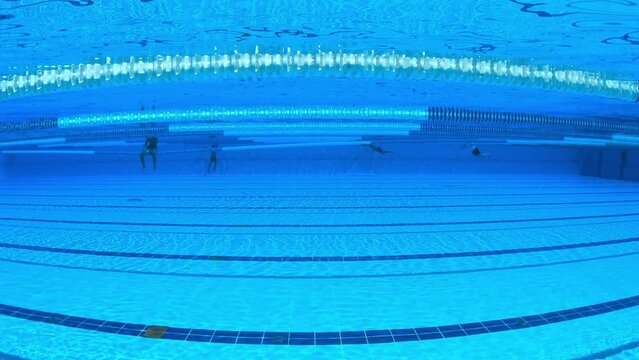 Olympic Swimming pool under water background.