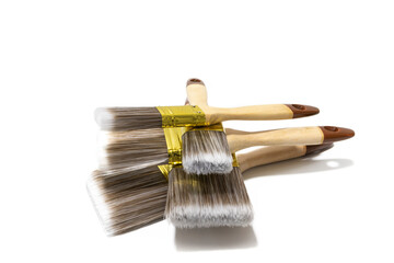 Lot of different sizes of paint brush , isolated on white background. Bristles can be made of various materials, such as natural hair, synthetic fibers, or a combination of both.