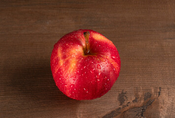 Red apple fruit isolated on wooden background