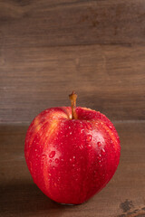 Red apple fruit isolated on wooden background