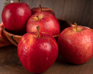 Red apple fruit isolated on wooden background