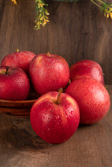 Red apple fruit isolated on wooden background