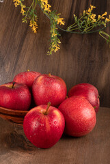Red apple fruit isolated on wooden background