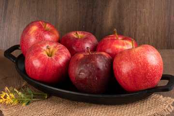 Red apple fruit isolated on wooden background