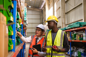 Group of Industrial workers working at a warehouse factory.