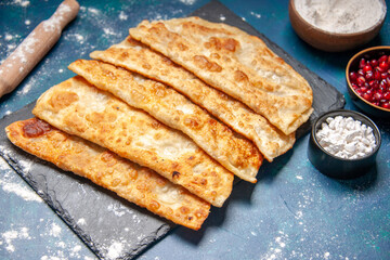 front view tasty gutabs thin delicious hotcakes with meat on blue background pastry bake oven pie cake meal color dough