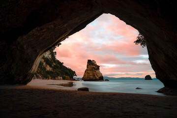cathedral cove beach, coromandel, north island, new zealand. Sunset view with colorful sky.