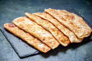 front view tasty gutabs thin delicious hotcakes with meat on dark background pastry bake oven pie cake meal color dough
