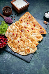 front view tasty gutabs thin hotcakes with meat and pomegranates on dark background pastry color oven meal dough pie cake