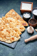 front view tasty gutabs thin hotcakes with pepper and salt on dark blue background color hotcake dough meal oven pie pastry cake