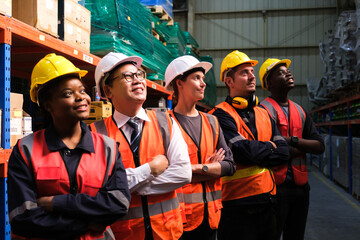 Group of Industrial workers working at a warehouse factory.