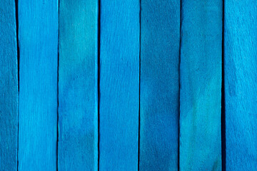 Fototapeta premium Old blue wooden background. Wooden textured background. Wooden painted blue boards are located vertically in a row.