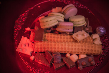 Candies and sweets on a plate. Concept of food, details. Sugar and anti diet