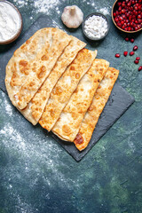 top view tasty gutabs thin delicious hotcakes with meat on a dark background pastry bake pie cake color dough oven meal