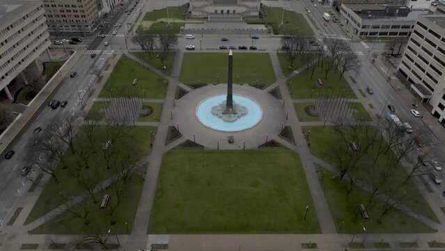 Veterans' Memorial Plaza in downtown Indianapolis with drone video wide shot tilting up.