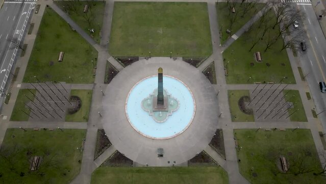Veterans' Memorial Plaza in downtown Indianapolis with drone video above view pulling back and tilting down.