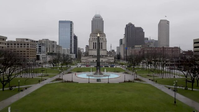 Veterans' Memorial Plaza in downtown Indianapolis with drone video low and moving forward and up.