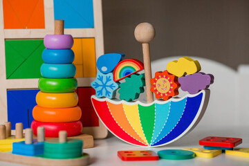 Balancer toys. Children's wooden toy in the form of an umbrella, color pyramid and educational...