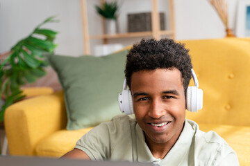 Smiling black man listening to music