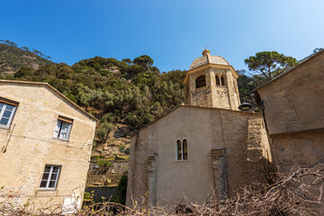 Facade of the ancient medieval San Fruttuoso abbey (San Fruttuoso di Capodimonte), X-XI century, place of worship between Portofino and Camogli, Genoa province (Genova), Liguria, Italy, Europe.